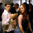 Pixelated image of two people in a crowded setting with repeated pink text "McLovin, McLovin, McLovin!" on black background.