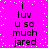 A static image with a bright pink background and scattered white dots, displaying repeated text in black pixelated font.