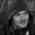 Black-and-white of nine showing a person in hooded clothing with changing facial expressions and mouth positions