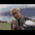 A pixelated animated sequence shows a person in a white shirt with a circular logo, transitioning from a standing pose to a seated position against a blurred outdoor background.