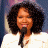 A 2x2 contact sheet of four distinct frames from an animated icon featuring a woman with curly hair in different outfits and backgrounds, plus the American Idol logo.