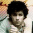 A pixelated image of a person with dark curly hair wearing a light-colored striped shirt, next to pink text boxes containing phrases like 'ur like a Legend!' and 'sir dude!'