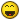 Pixelated yellow circular face with closed eyes, dark brown mouth opening showing red tongue, and gradient shading on the outer edges.