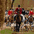 Animated sequence showing horseback riders in various equestrian scenes with text overlays.