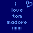 Blue background with light blue pixelated text and symbols arranged in two , featuring 'i love tom madore' and six exclamation marks below