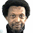 Pixelated image of a person with dark curly hair and light skin, wearing a black turtleneck shirt against white background.