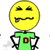 Pixelated yellow smiley face icon with a green shirt featuring a red square, black arms crossed, and one visible tooth.