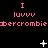 Pixelated pink text and symbols on black background with animated white star-like elements shifting positions across frames.