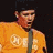A pixelated image shows a person in an orange shirt with Chinese characters, next to a circular logo on a teal background and white text reading BLINK 182.