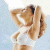 A 50x50 pixel animated buddy icon featuring a woman in a white bikini top with hands behind her head, alongside green text reading "Original Icons .com" on a dark background.