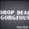 Static image of repeated text 'DROP DEAD GORGEOUS' in large white letters on dark gray background with 'drop dead' in smaller light blue text below.