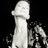 Static pixelated icon of a light-colored figure with indistinct facial features against black background, showing partial body and head in profile view.
