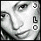 Pixelated grayscale portrait of a person with subtle facial features, accompanied by three vertically stacked black-and-white symbols on the right.