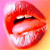 Pixelated close-up of red lips with visible teeth and a black mustache-like shape, set against a pink-to-orange gradient background.
