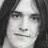 A black-and-white image of a repeated face with overlaid text reading "THE ALL-THE ALL-AMERICAN REJECTS" in pixelated font.
