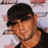 Pixelated image of a person wearing a dark cap and shirt with pink text on black background reading 'I LOVE MY BOM-CHICA-WOW-WOW!!'