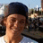 A person wearing a dark cap and white shirt appears in a of four with text overlays reading 'I', 'love', 'you', and '<3' across different positions