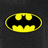 Yellow and black Batman logo with a pixelated style on a dark gray background.