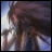 Pixelated anime-style character with long dark hair and light blue clothing against a bright sky background, next to stylized text on black.