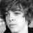 Black-and-white pixelated image of a person with curly hair next to text reading 'SOME PEOPLE YOU CAN'T STOP THINKING OF RYAN SHECKLEF CAN ONLY IS ONE OF DREAM... THEM SO.. BYE BYE CUTE BUT~MONICA~'