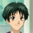 A 48x48 pixel buddy icon featuring a cartoon character with dark green hair and brown eyes on the left, paired with stylized text reading "Anime IM" above "COM" on a black background to the right.