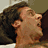 A 48x48 pixel animated contact sheet showing three frames of a meme featuring two shirtless men and text reading "The 40 Year-Old Virgin" on an orange gradient background.