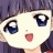 A pixelated anime-style character face with purple hair and large blue eyes on the left, next to a black background with white text reading "Anime IM" and "cOm" on the right.