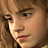 Static pixelated image of a person's face with light brown hair and fair skin, showing partial facial features in profile view.