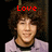 Two side-by-side pixelated images of a person with curly brown hair wearing a light purple shirt, each displaying different red text above the head.