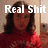 Pixelated image of a person with dark hair wearing a red top, overlaid with large white text reading 'Real Shit' against a light brown background.