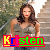 A woman with long brown hair stands on stone steps outdoors, wearing a sleeveless gray top and blue jeans. The name "Kristen" appears below her in colorful pixelated text.
