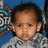 A child in a gray patterned shirt against a blue background with partial text, shown across where the rightmost frame is blank