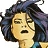Pixelated image of a person with dark wavy hair, closed eyes, and an open mouth showing teeth, wearing a blue garment with visible collar.