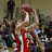 A pixelated animation of a basketball player shooting a ball through a hoop, with the net swaying and the ball in mid-air.