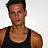 Static 48x48 pixel buddy icon showing a man in a dark tank top against a light background with visible pixelation and dithering artifacts.