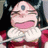 Pixelated static image of a cartoon character with pink skin, closed eyes, and a wide open mouth showing teeth, wearing a white ruffled collar over red clothing against dark background.