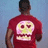 A person in a red shirt with a skull graphic stands against a blue background, with red pixelated text on a yellow background reading "i wish i had class like chidi".