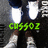 Pixelated image of a character in dark clothing with white accents and green text overlay.
