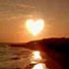 A static 100x100 pixel buddy icon depicting a heart-shaped sun or light source over water at sunset, with warm orange and yellow tones dominating the scene.