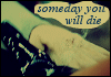 A hand in a light green sleeve holds a dark object with white markings, with a yellow speech bubble containing blue text.