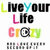 Pixelated text reads 'Live Your Life Crazy' with color variations on individual letters and a stylized '@' symbol replacing the 'a' in 'Crazy'.