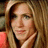 A pixelated image of a person with long light brown hair wearing an orange top, next to pink text on dark blue background reading HJNTIY In Theaters 2009.