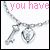 A 4-frame animated contact sheet showing a silver necklace with key and heart pendant, each frame displaying different pink text over the same necklace image.