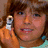 A pixelated image shows a person holding a phone to their ear against a blue background with text reading 'dylan is hot and cute'.