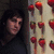 A static image with a green background, red text elements, and a small photo of a person next to strawberry icons.