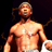 Static pixelated image of a shirtless man with light skin tone, short gray hair, and visible facial features against dark background.