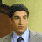 A 48x48 pixel animated contact sheet showing two frames of a man in formal attire against a yellow background with brown architectural elements.