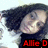 Pixelated image of a person with dark hair and light skin wearing a black shirt, red text at bottom reads "Allie D".