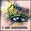 A static icon features a human eye with green and black patterned eyelid, a yellow flower with white petals, and pixelated text reading 'i am beautiful' at the bottom.