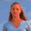 A woman with light brown hair and a blue shirt appears in four sequential poses against a solid blue background.